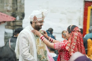 Bride and groom sharing a candid wedding moment during a traditional ceremony in Triyuginarayan.