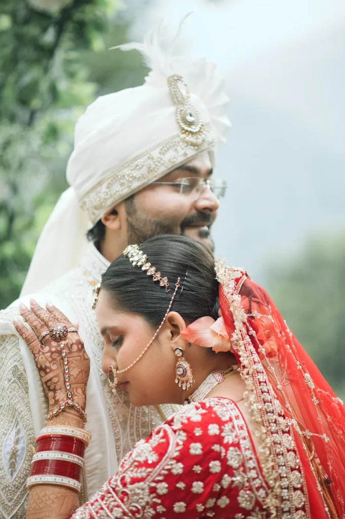 Bride and groom sharing a tender moment during a destination wedding at Char Machan Resort Guptkashi