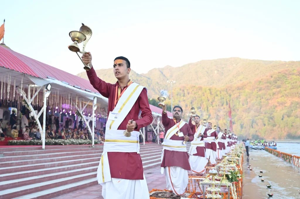 Priests performing a traditional Ganga Aarti ceremony beside the river. Traditional Ganga Aarti ceremony with priests performing rituals beside the river