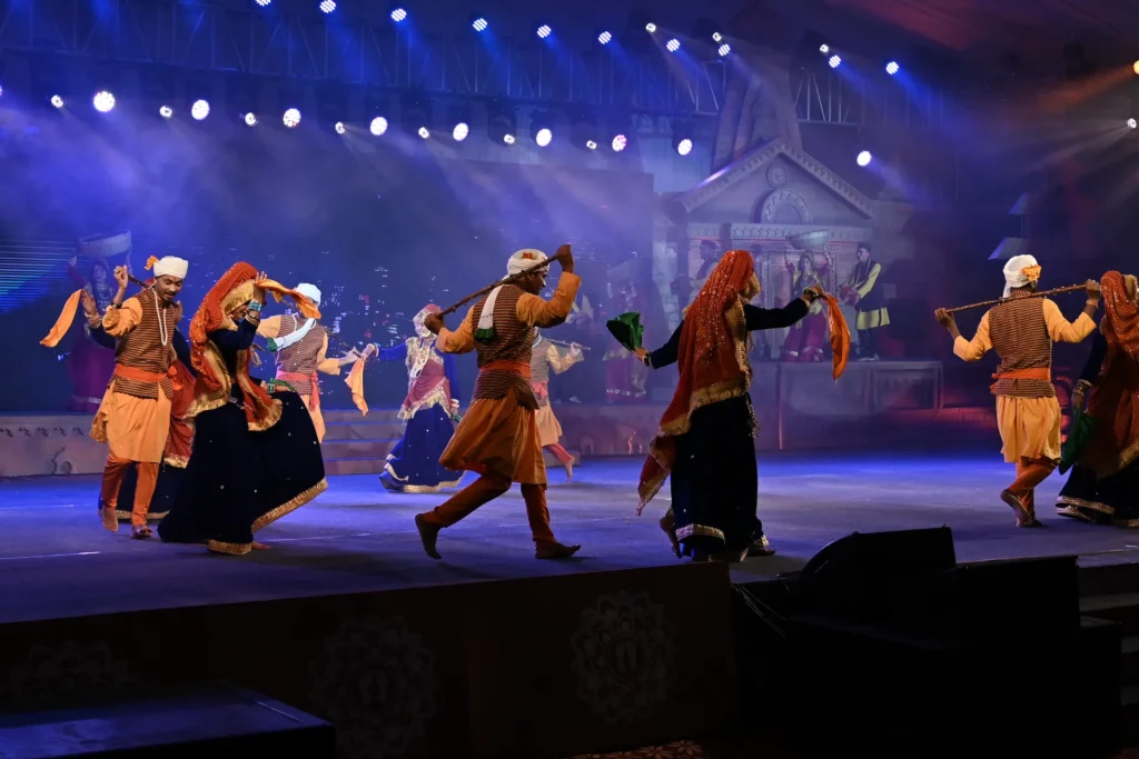 Traditional cultural dance performance during a vibrant stage event. Traditional cultural dance performance on stage at an event in Dehradun