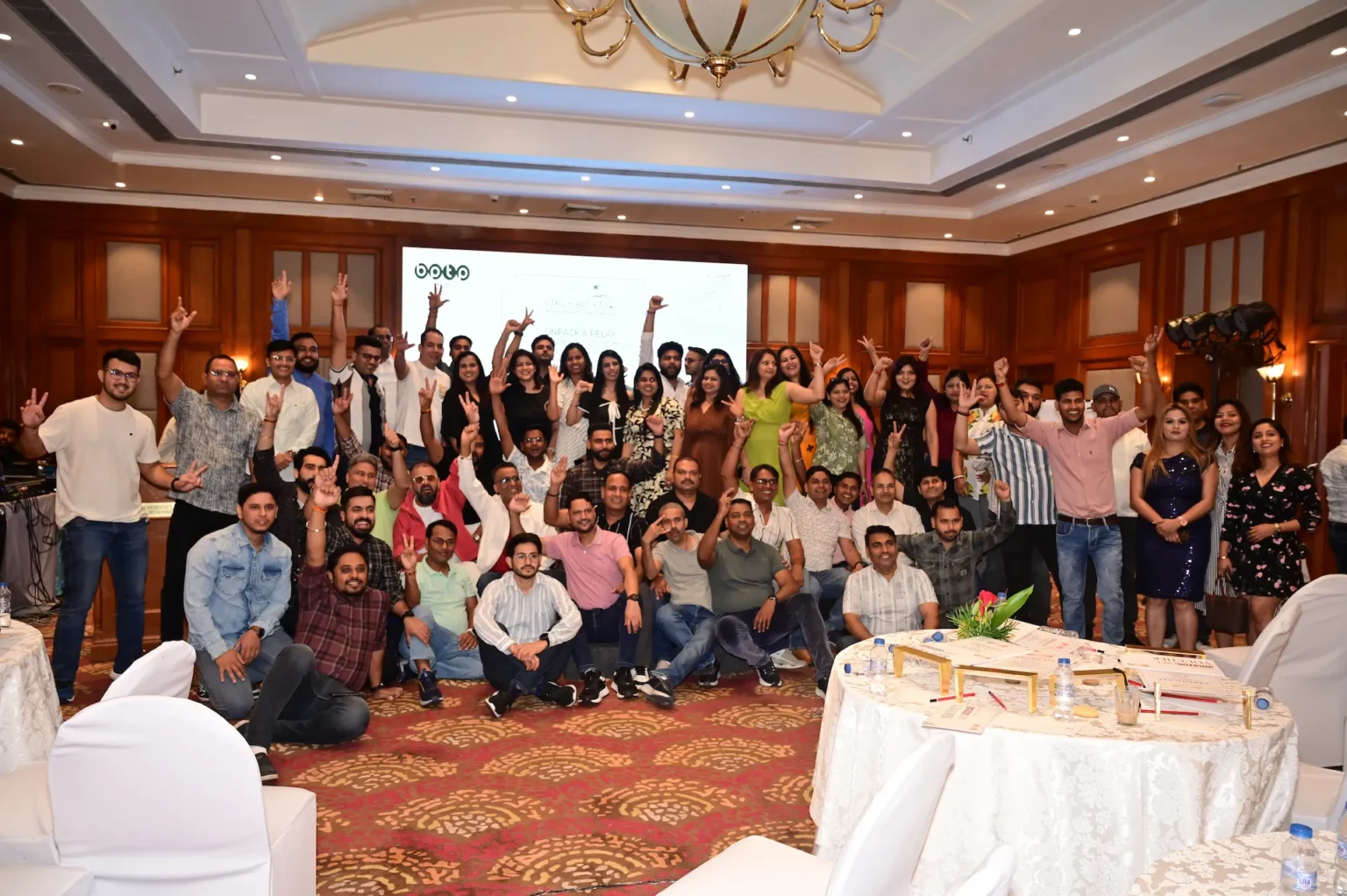 Large corporate team group photo at an event in Mussoorie