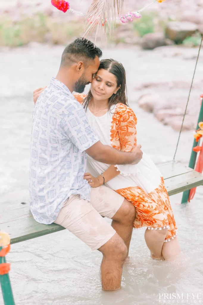 Couple sharing a romantic embrace during a pre-wedding shoot near Laxman Jhula.