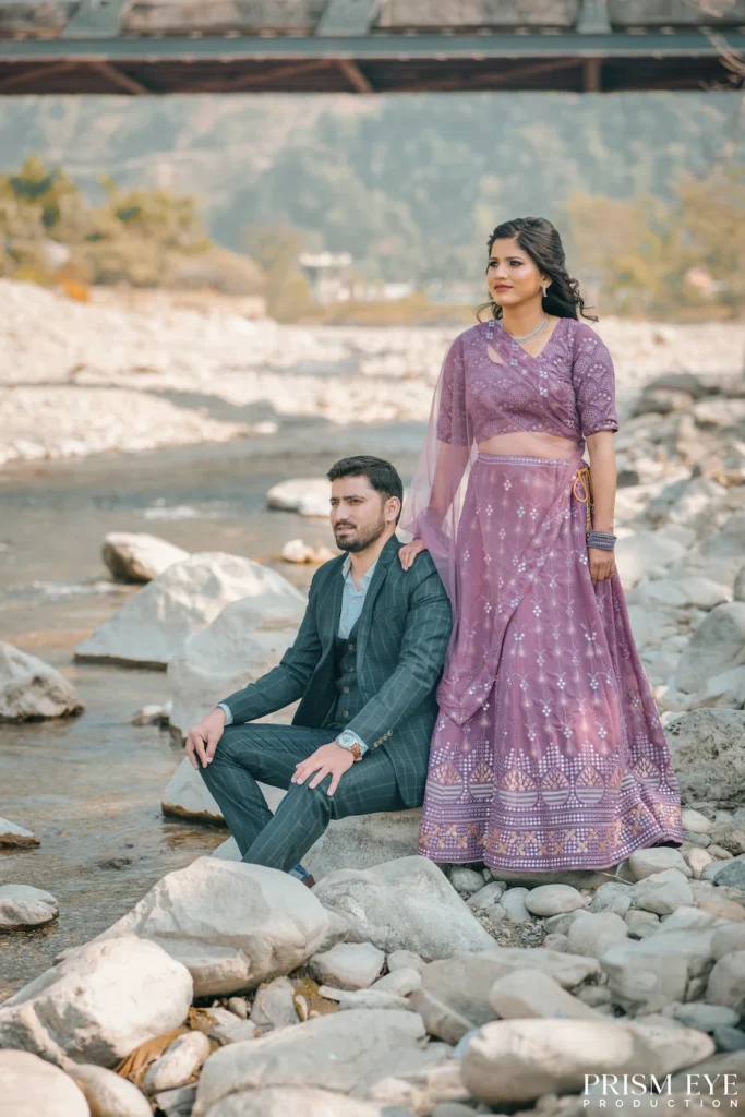 Couple posing by the Ganga riverbank in Rishikesh.