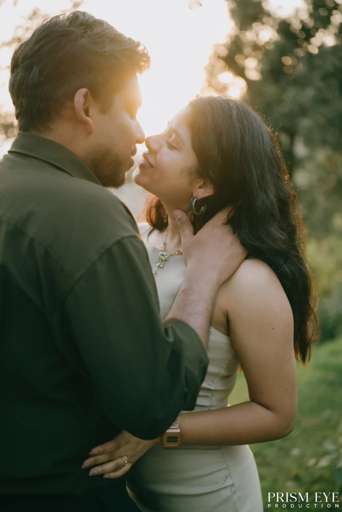A couple sharing a tender moment as they look at each other in the evening light