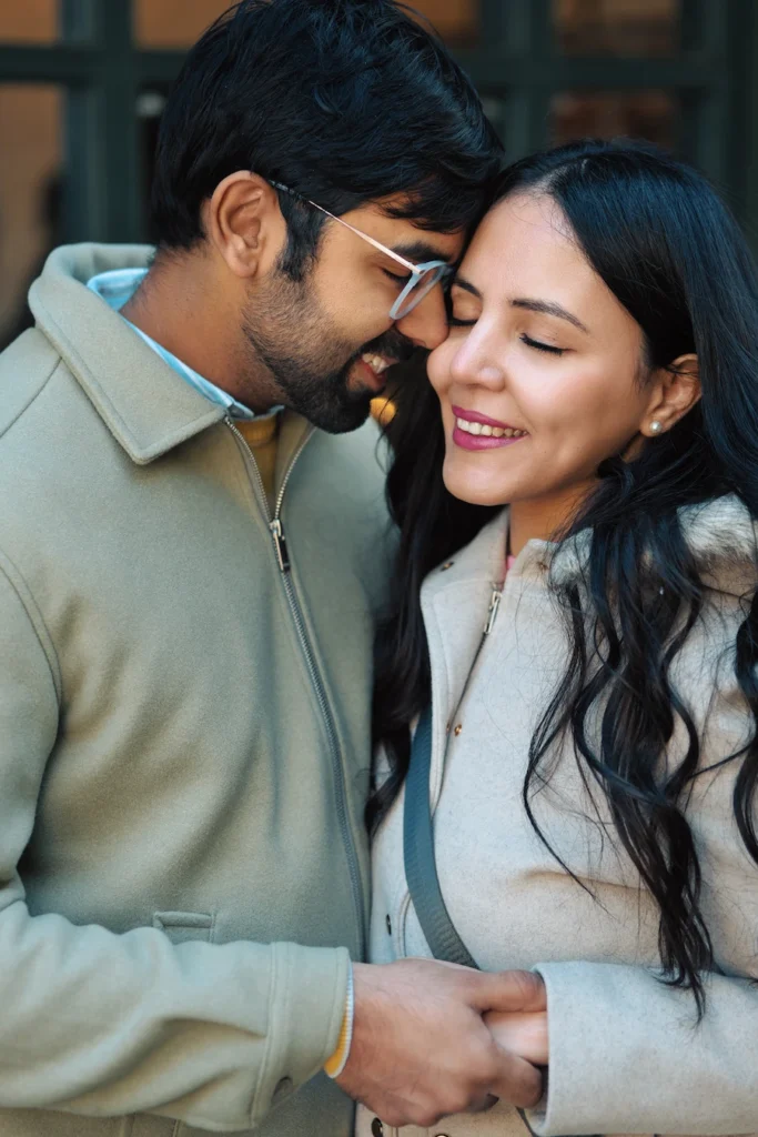 Couple sharing an intimate moment outdoors.