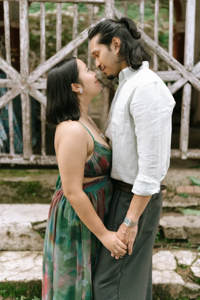 A couple standing close together and sharing a tender moment