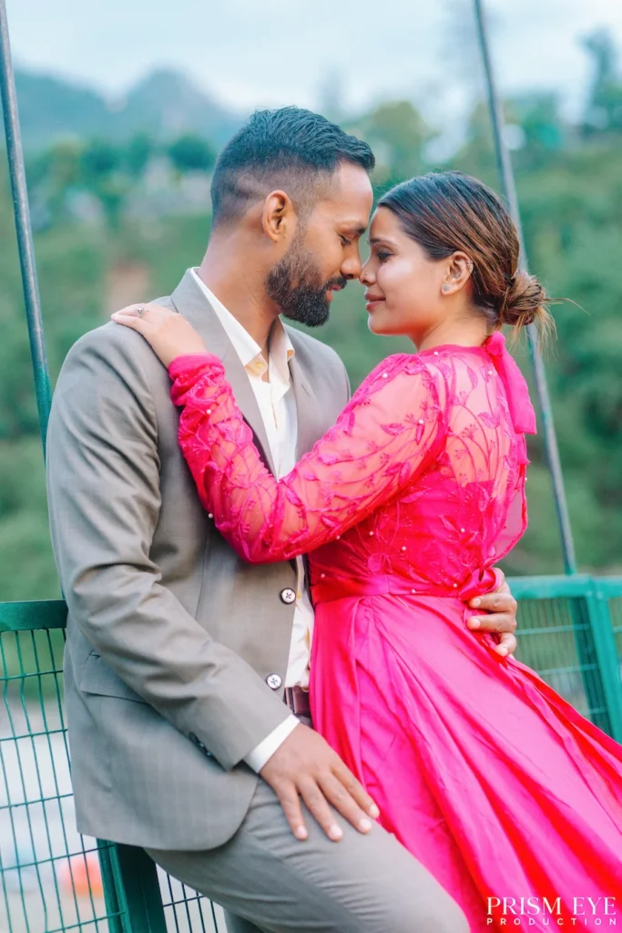 Couple sharing a romantic embrace during a pre-wedding photoshoot in Rishikesh, dressed in elegant outfits.