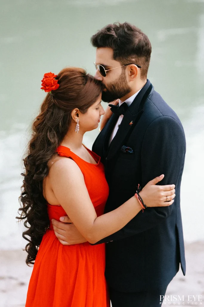 Couple embracing by the Ganga during a romantic photoshoot in Rishikesh.