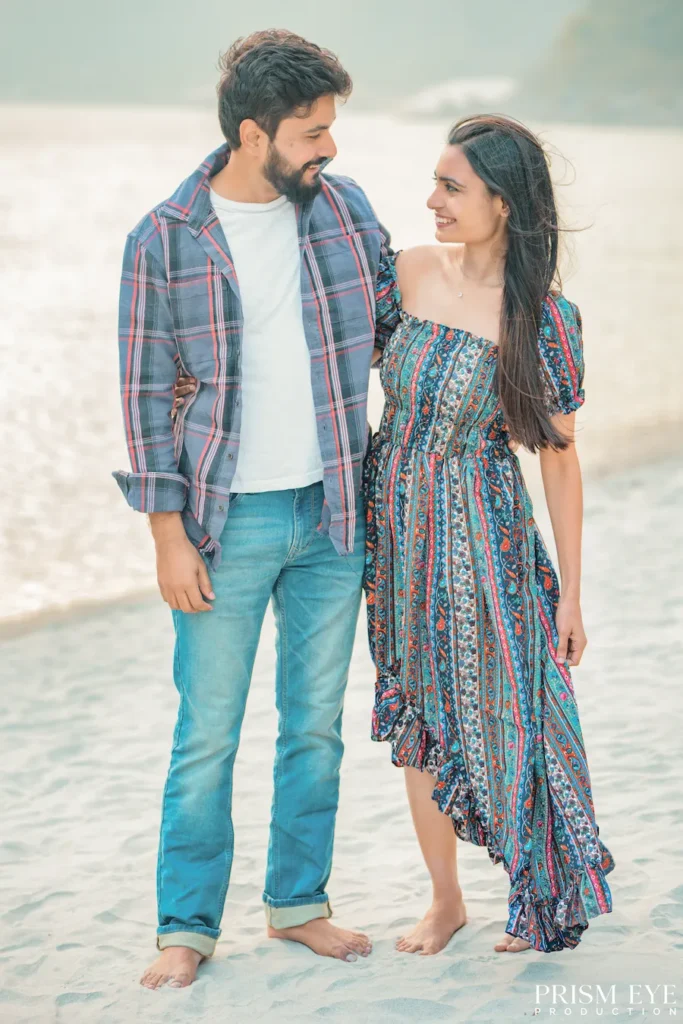 Couple sharing a sweet moment together during a beachside photoshoot in Shivpuri, Rishikesh.