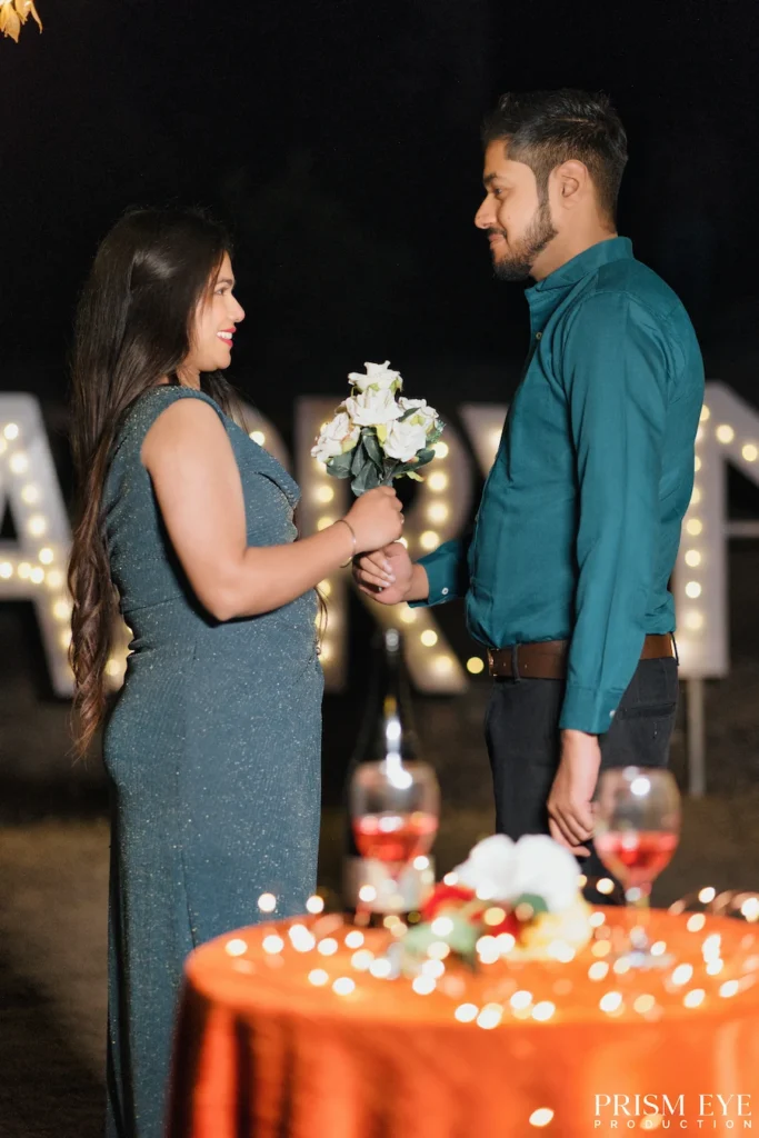 Couple sharing a romantic moment during an evening proposal photoshoot in Rishikesh.