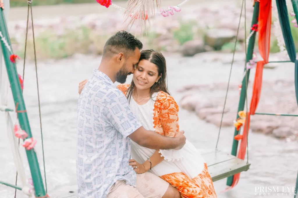 Couple sharing a sweet moment on a swing near Ram Jhula