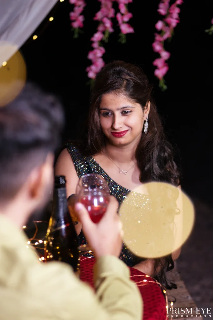 Couple sharing a romantic toast near Laxman Jhula