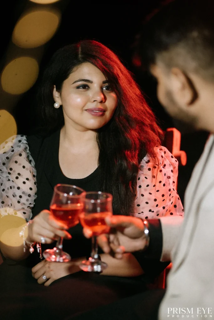 A couple shares a romantic toast during a surprise proposal in Rishikesh