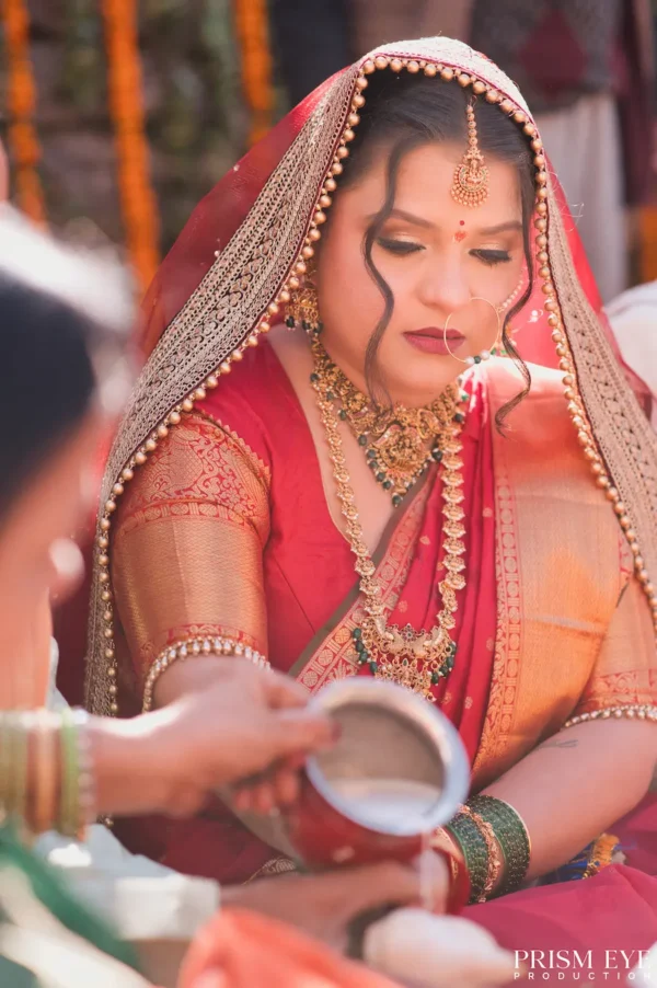 Bride taking part in a traditional wedding ritual during a ceremony at Triyuginarayan.